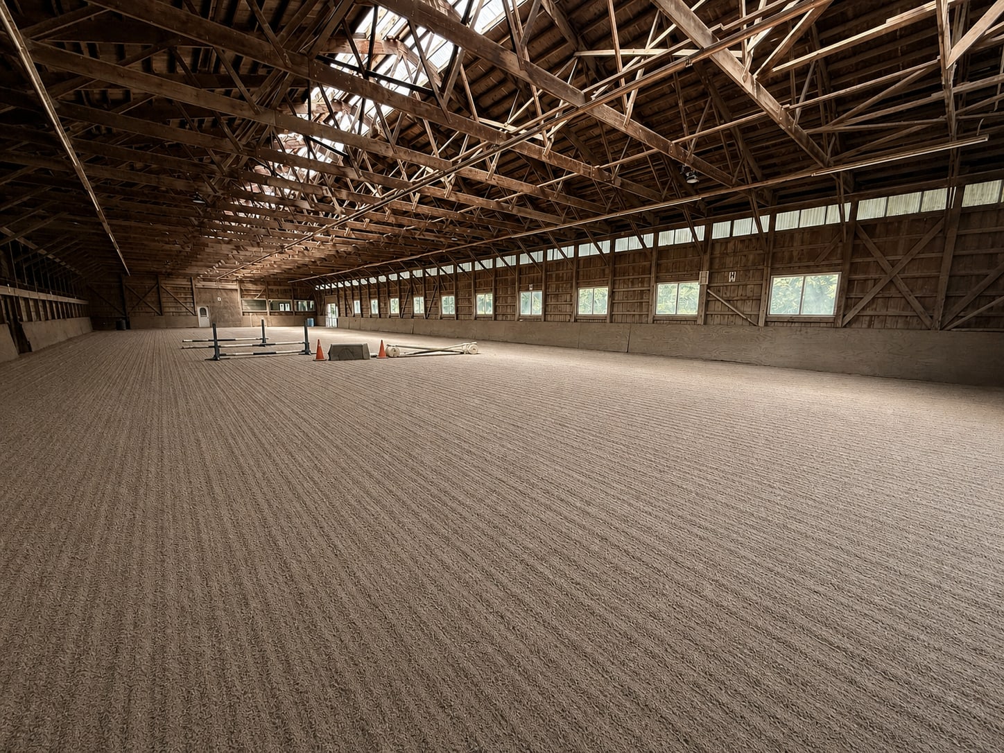 Wide interior view of the River Vu Farms indoor riding arena
