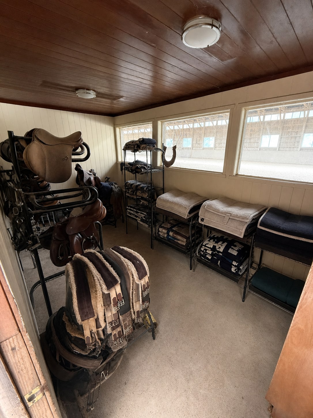 Old viewing room with organized tack at River Vu Farms
