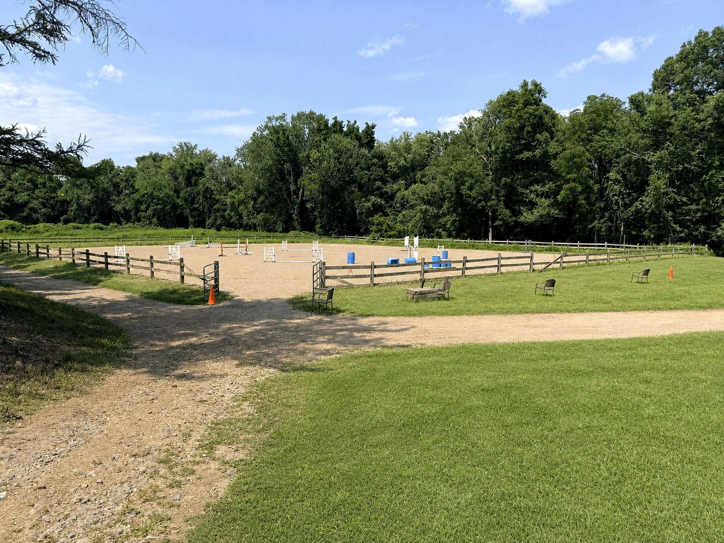 Fenced outdoor riding arena at River Vu Farms